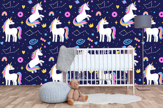 Galaxy unicorns nursery wallpaper behind a white crib with a gray floor lamp and teddy bear
