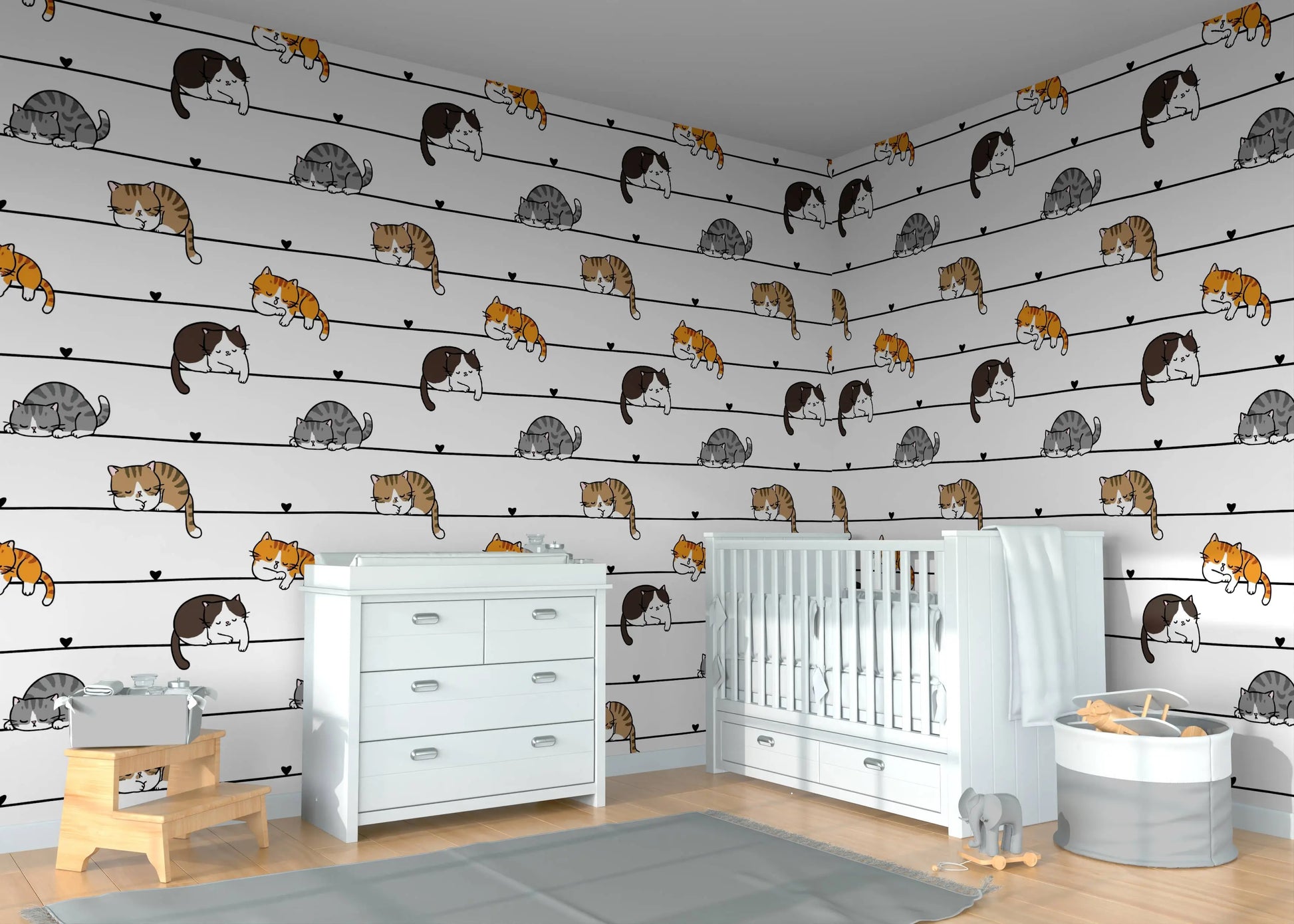 Cartoon cats wallpaper mural in a nursery corner with a white crib and dresser