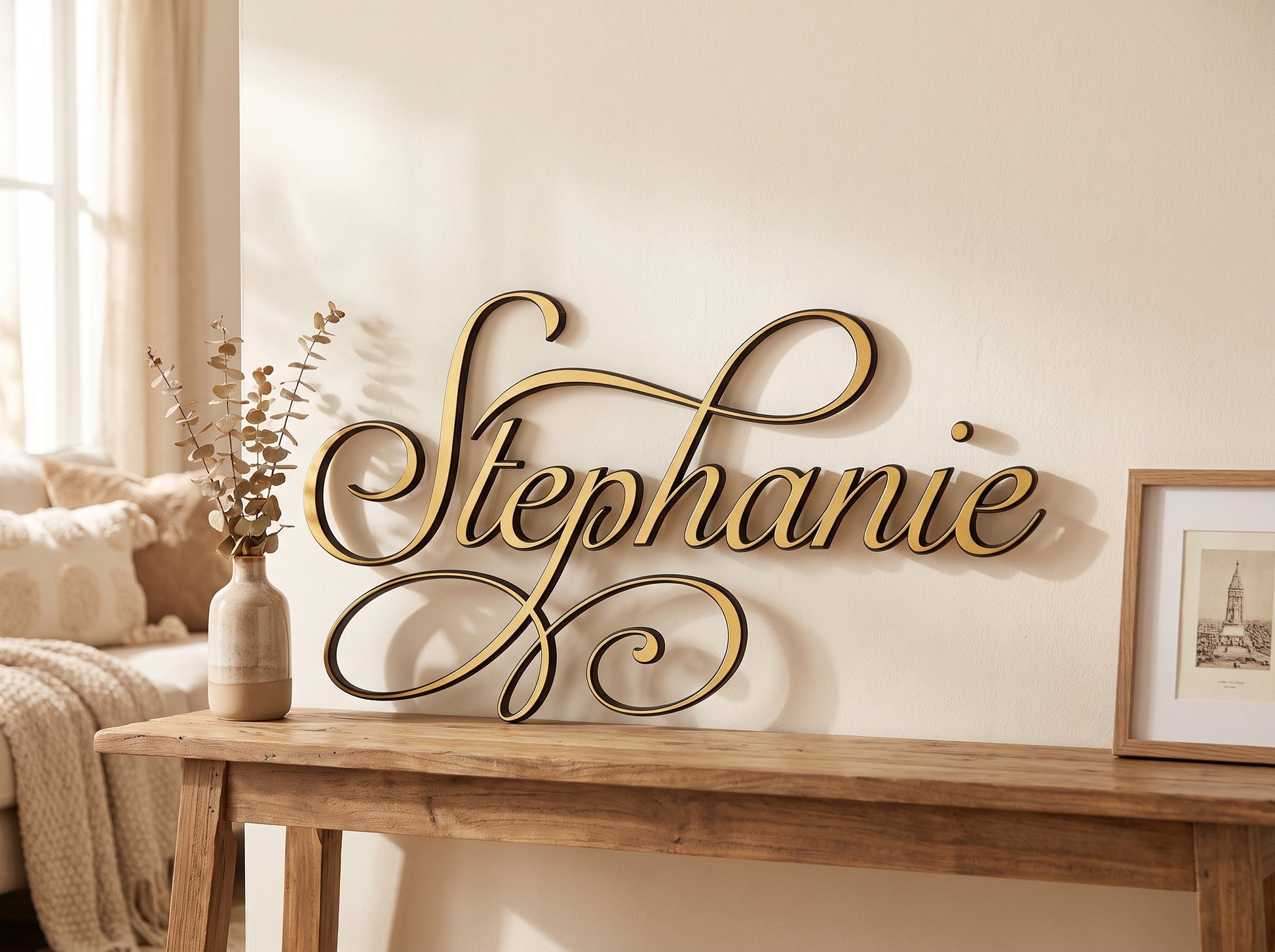 Custom cursive wood name sign "Stephanie" in gold, displayed on a console table