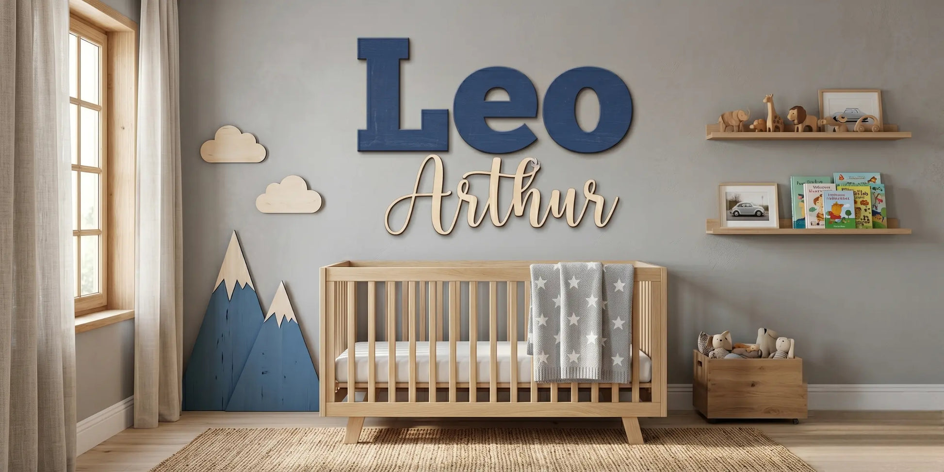 Custom "Leo Arthur" wood name sign in navy script against a mountain-themed nursery wallpaper