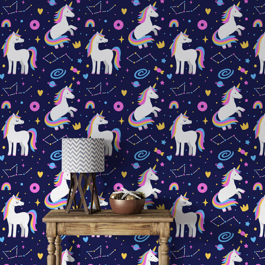 Galaxy unicorns wallpaper behind a wooden console table with a patterned lamp and decor bowl