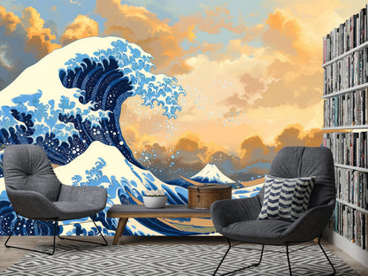 Great Wave off Kanagawa wall mural behind two gray armchairs and a bookshelf in a living room reading nook