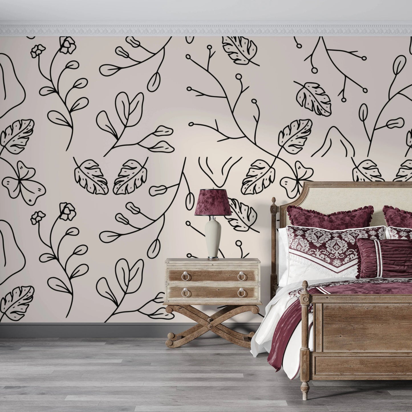 Minimal botanical line art wallpaper behind a bed with burgundy bedding in a bedroom