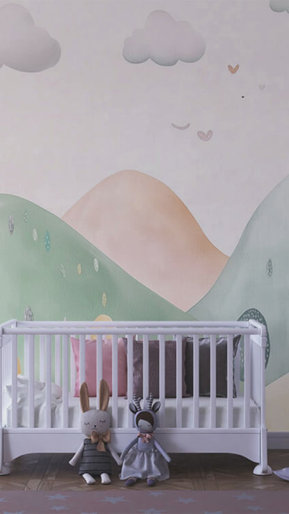Pastel hills mural in a toddler playroom with bookshelf and toys