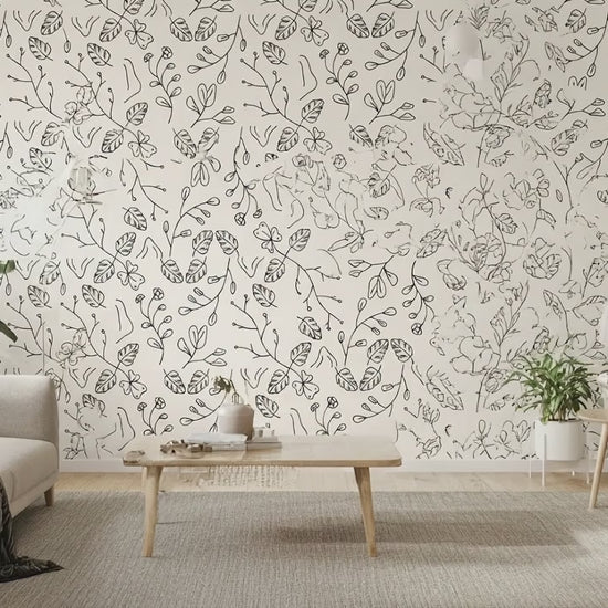 Video preview of the minimal line art botanical wallpaper installed in a bright living room with plants