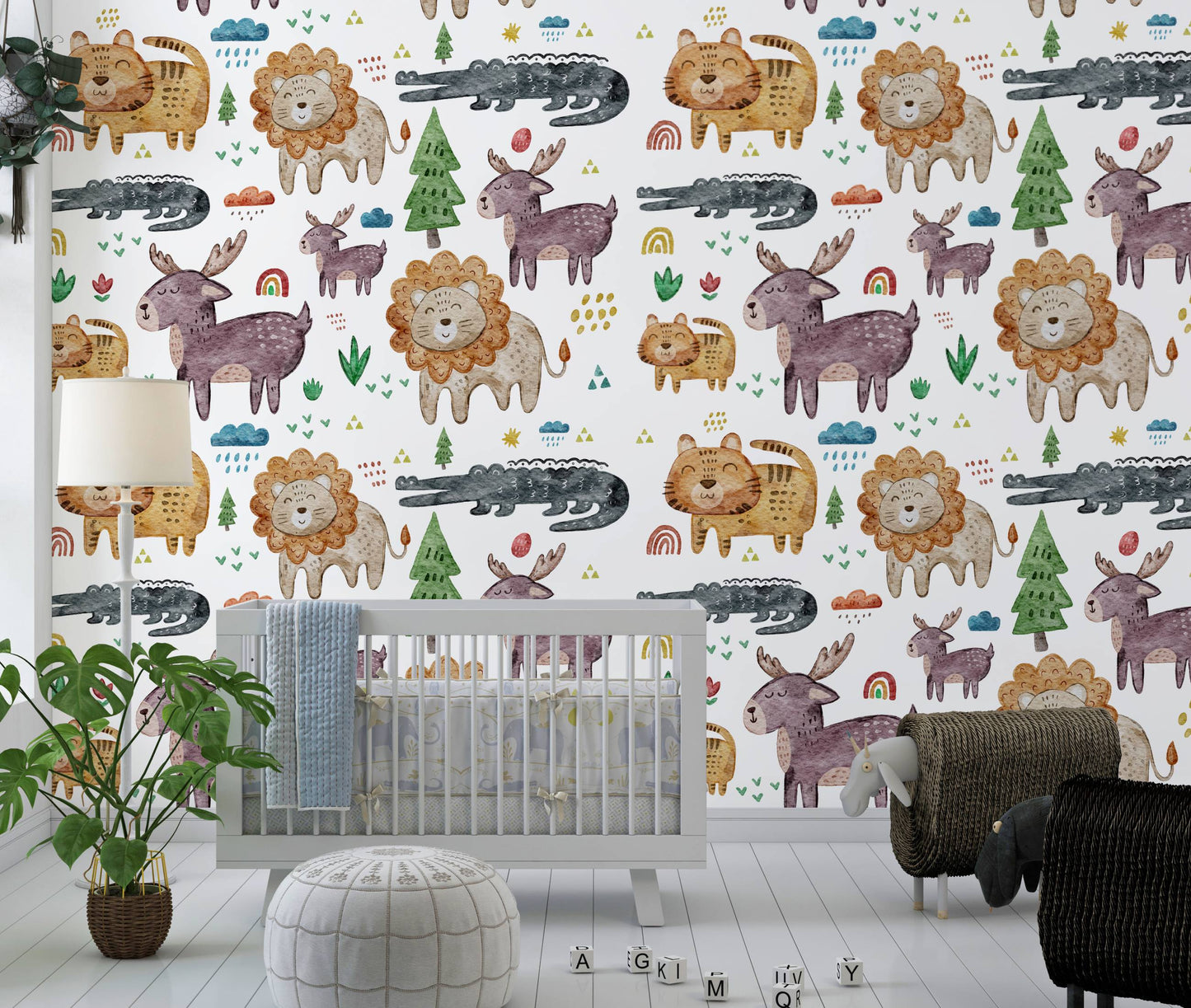 Safari animals nursery wallpaper behind a gray crib with a floor lamp and monstera plant