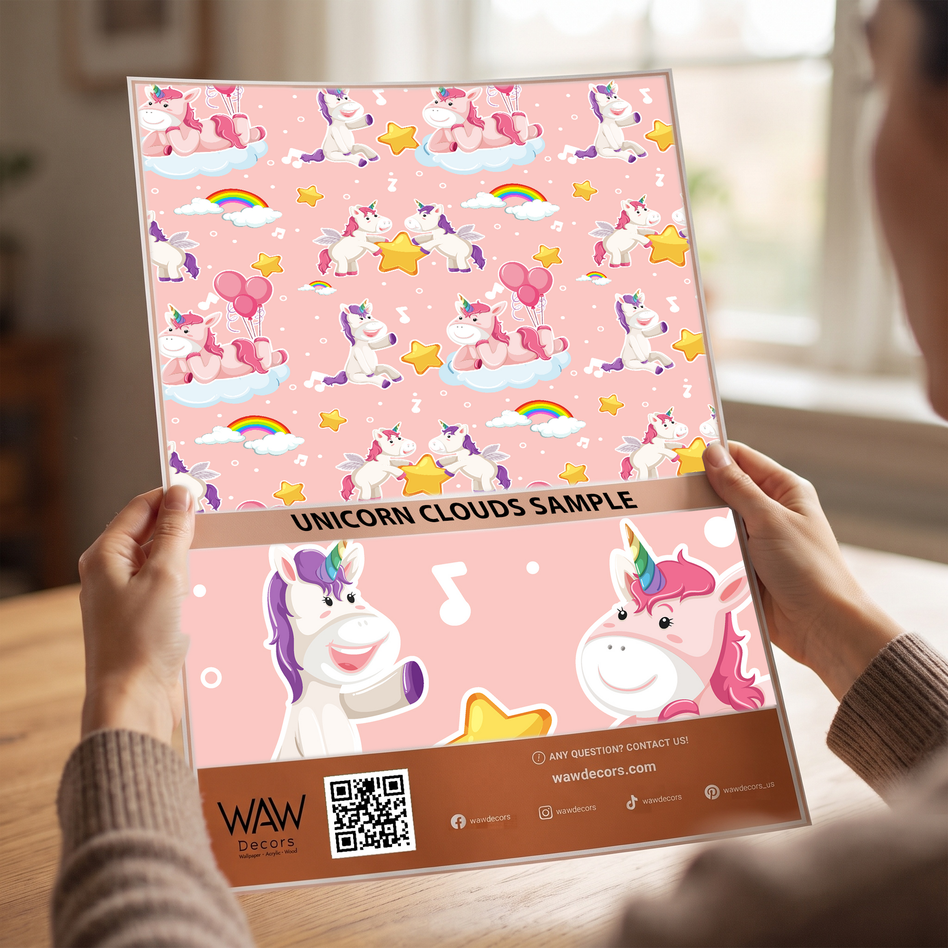 Close-up detail of the unicorn clouds nursery wallpaper print showing rainbows and stars