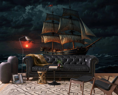 Vintage sailing ship wall mural with a dramatic sunset seascape, behind a dark leather sofa in a moody living room