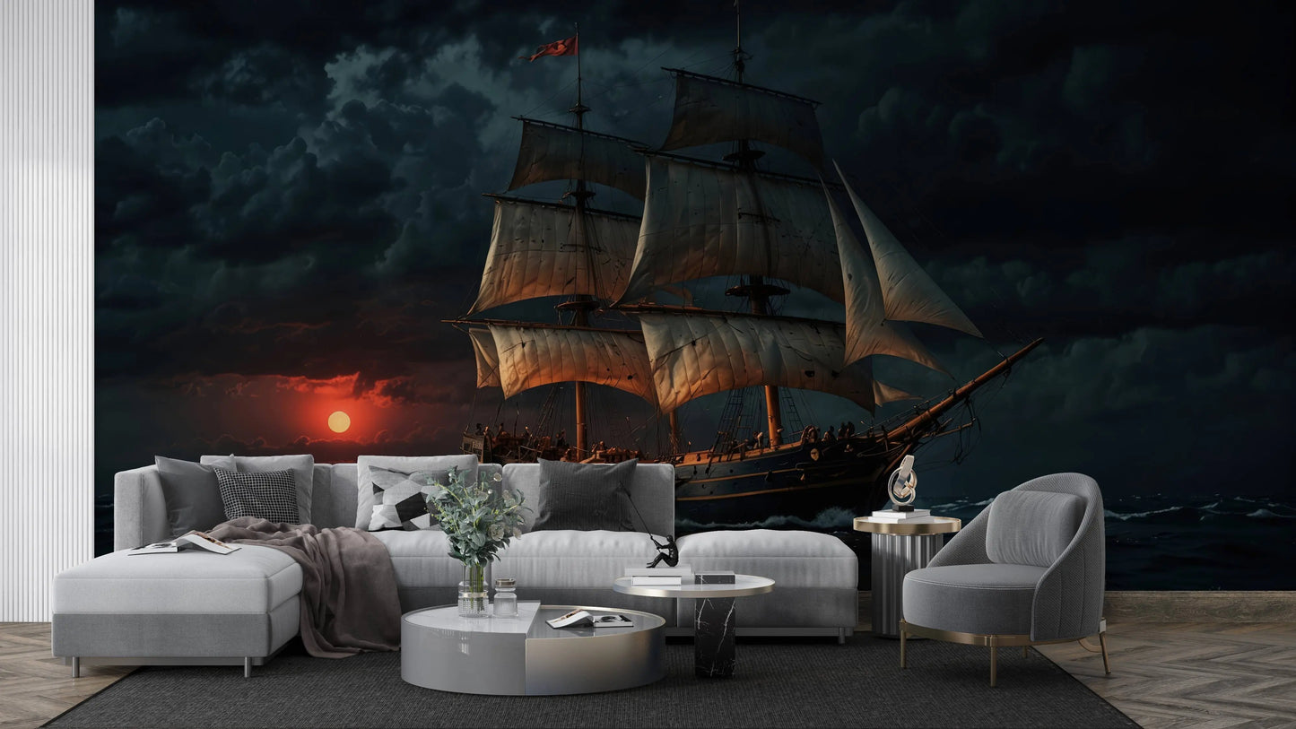 Vintage sailing ship wall mural with a dramatic sunset seascape, behind a gray sectional sofa in a modern lounge