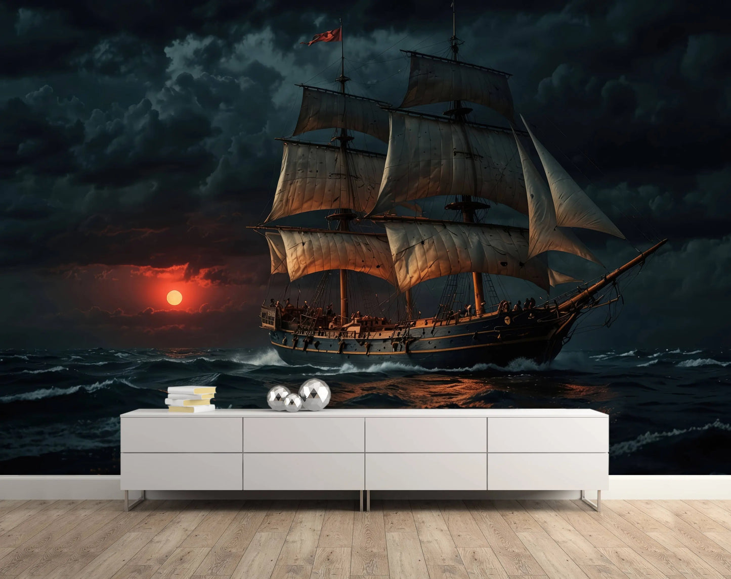 Vintage sailing ship wall mural with a dramatic sunset seascape, installed behind a white console in a living room
