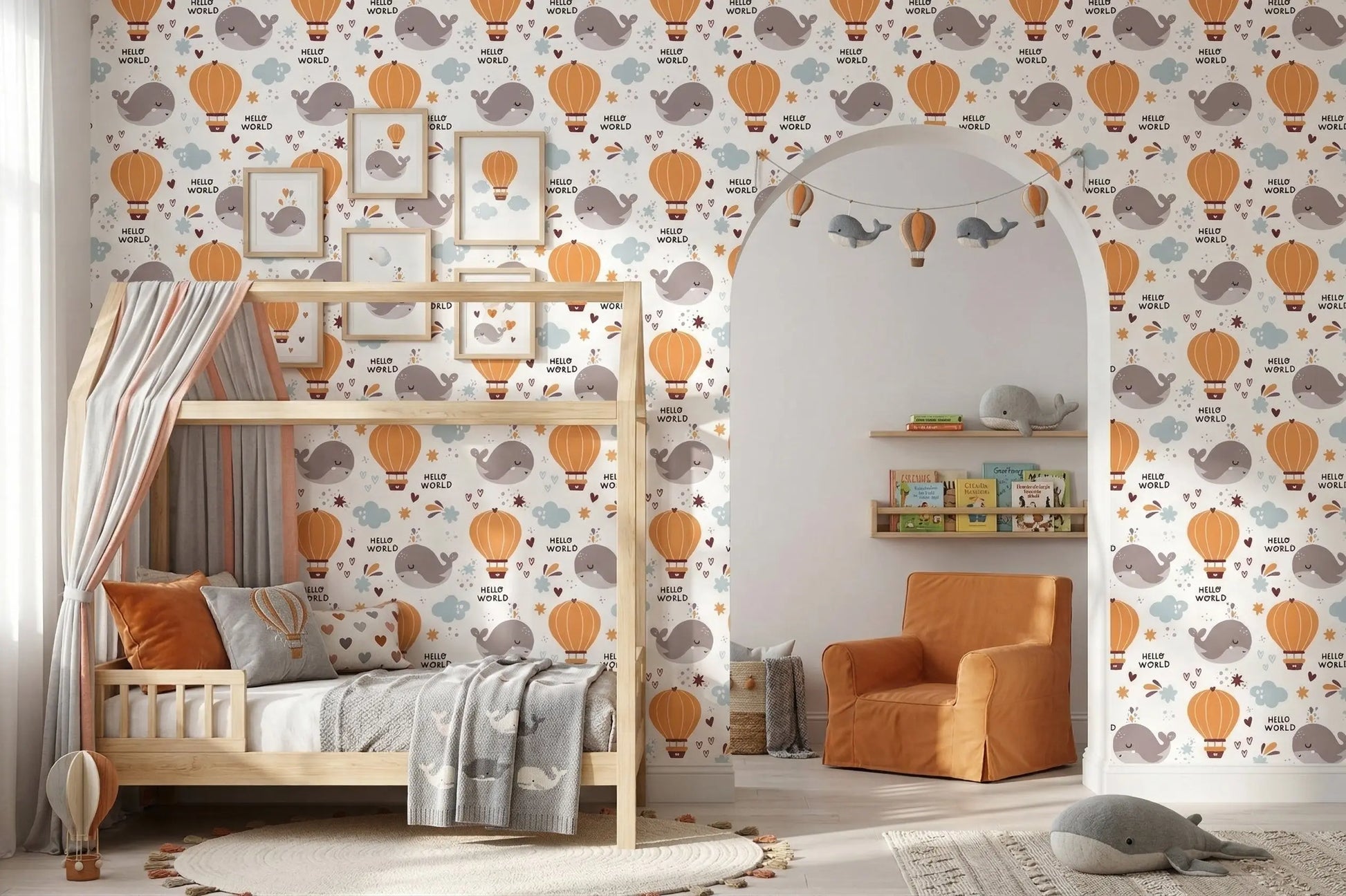 Hello World whale nursery wallpaper behind a canopy daybed with an orange color palette