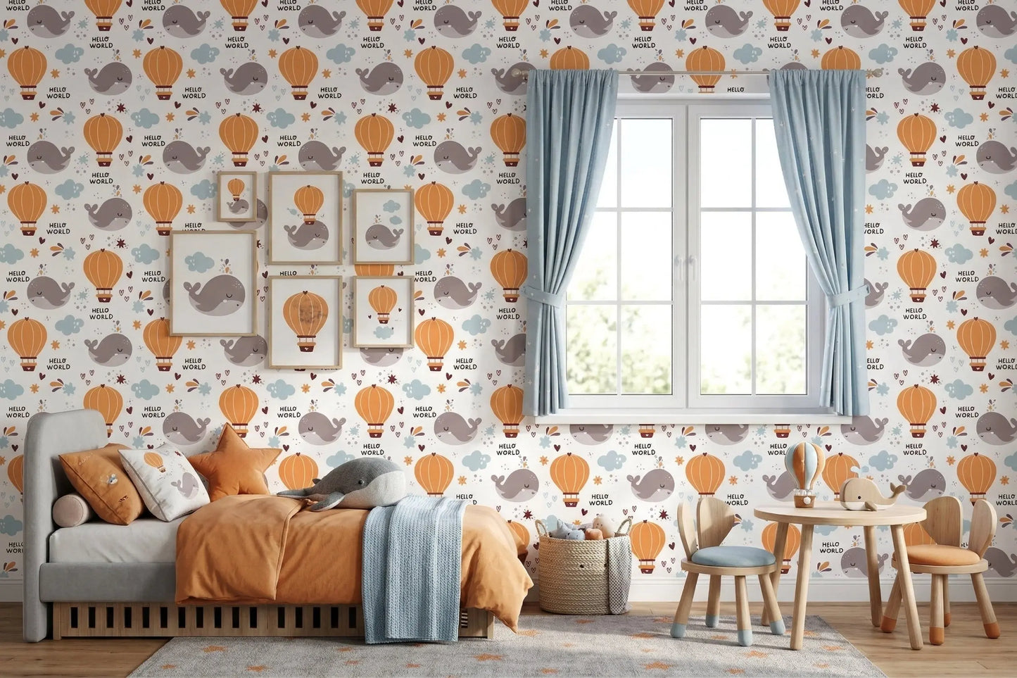 Hello World whale wallpaper behind a daybed and a kids' play table with blue curtains